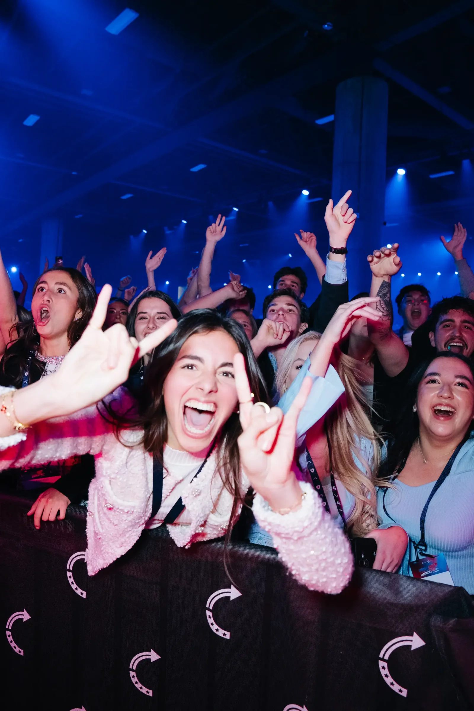 AmericaFest attendees cheering during the live program AmericaFest attendees cheering during the live program